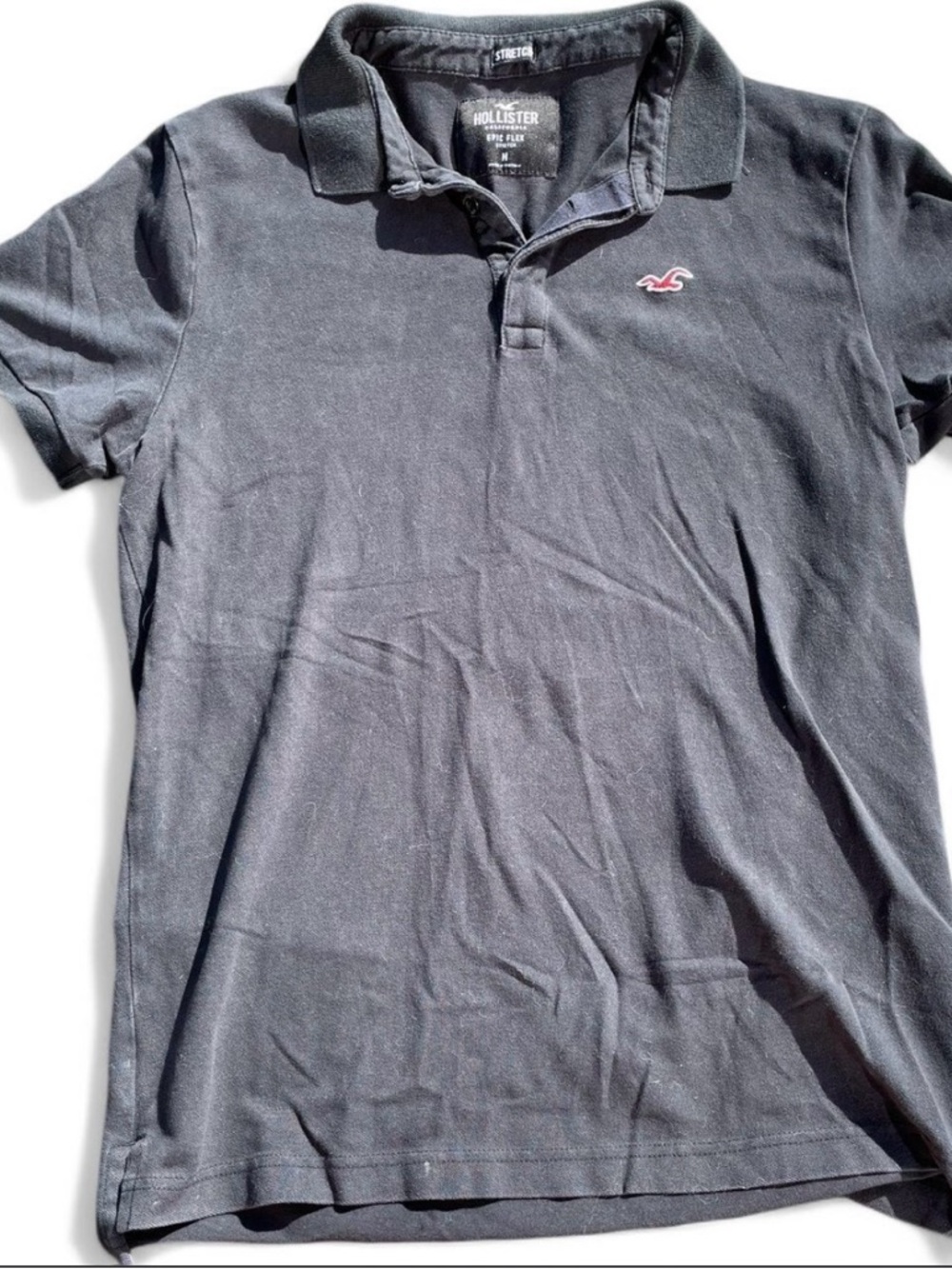 Hollister navy blue Men's Polo with red logo